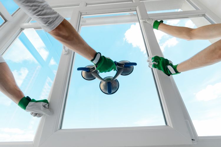 2 men installing residential windows