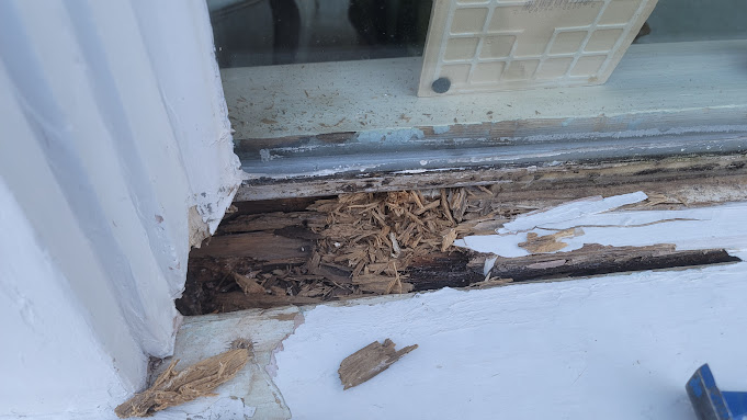 Image is of a rooted window frame, concept of 10 signs its time for replacement windows