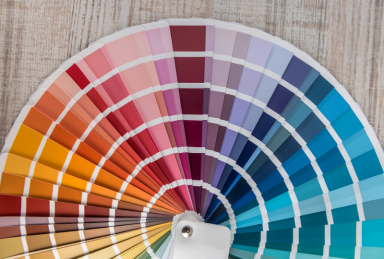 Image is of a paint swatch palette, concept of choosing perfect color for new front door installation.