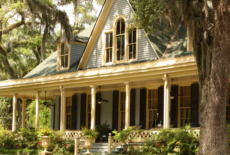 Image is of a historical southern Gothic style farmhouse, concept of window design for historical home renovations